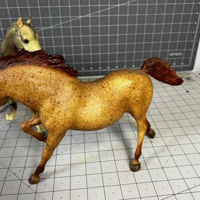 2 Breyers - 1 is an Appaloosa Horse, one Tan Horse.