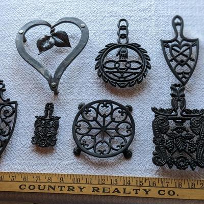 Collection of 7 Vintage Cast Iron Trivets, heart
