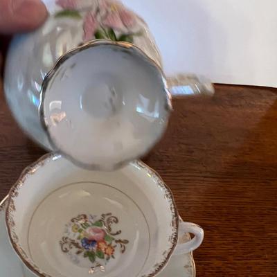 4 Tea Cups Mostly white with Flowers