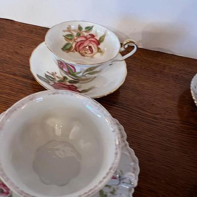 4 Tea Cups Mostly white with Flowers