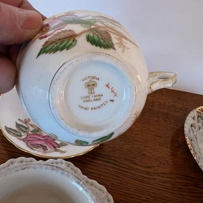 4 Tea Cups Mostly white with Flowers