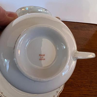 4 Tea Cups Mostly white with Flowers