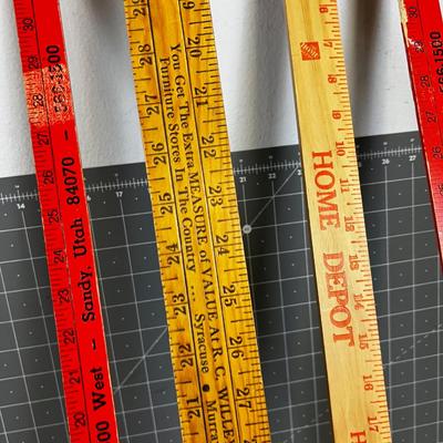 (4) Yard Sticks 