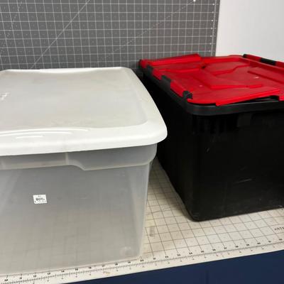 2 Storage Tubs Clear and Black. 