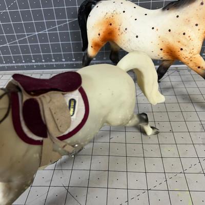 2 Breyers - Appaloosa Horses, 1 has a saddle