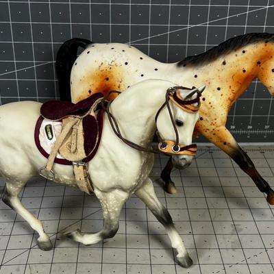 2 Breyers - Appaloosa Horses, 1 has a saddle
