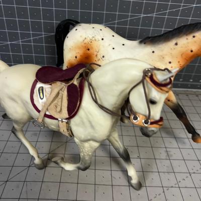 2 Breyers - Appaloosa Horses, 1 has a saddle
