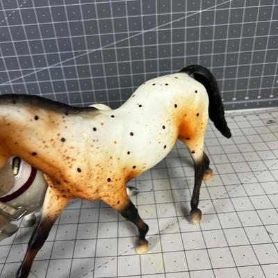 2 Breyers - Appaloosa Horses, 1 has a saddle