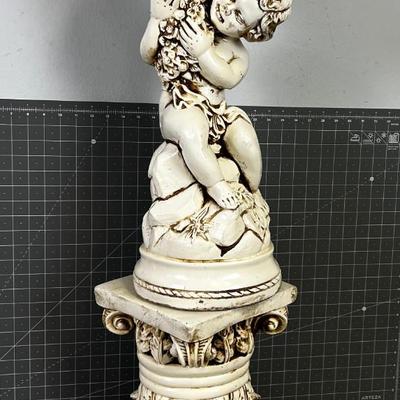 Cherub With and Urn on a Pedestal  