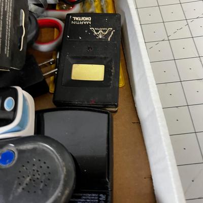 Tray of Electrical things; Cables, juice pack, garage Door openers, Alarms