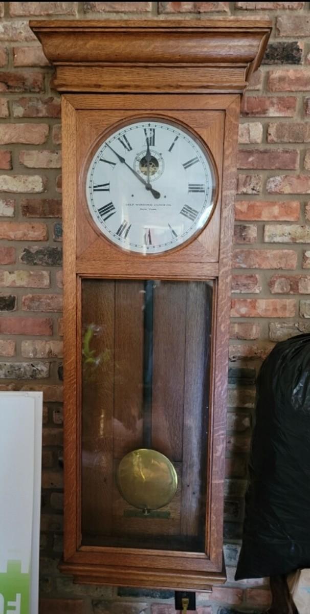 Selfwinding clock. Large brass pendulum. 63” high, 19” wide, 7” deep