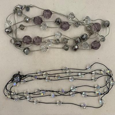 2 Single strand long necklaces with clear and grey beads.