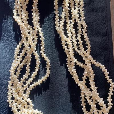 6-strand pearl colored necklace