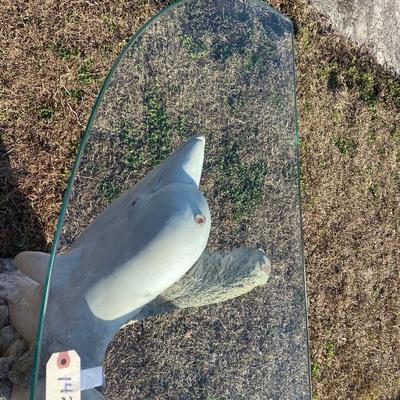 A dolphin base Accent Table