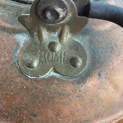 Antique copper kettle with wooden handle