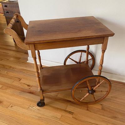 Antique cherry wood tea cart on wheels