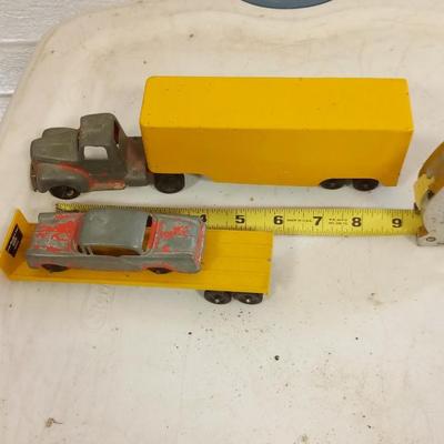 LOT 192    OLD TOY TRUCK AND TWO TRAILERS