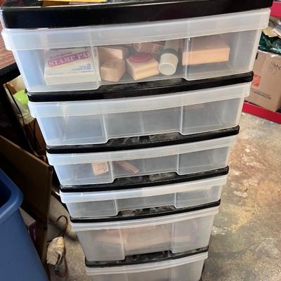 Hundreds of un used rubber stamps, many in sets in a rolling six drawer storage chest 16 X 16 X 31