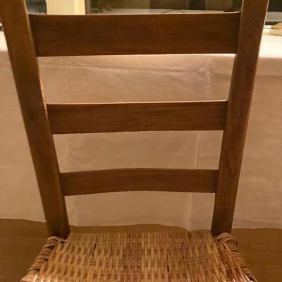 Two antique ladder back mission chairs with woven seat