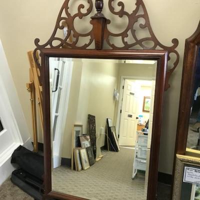 Mirror with decorative top and bottom