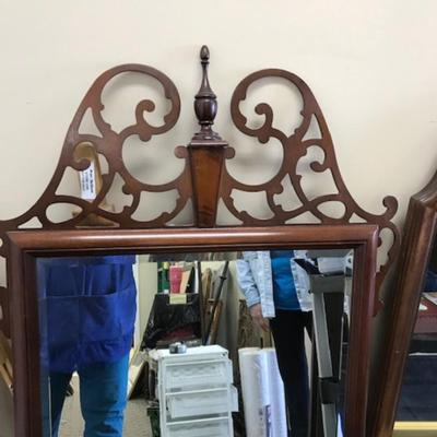 Mirror with decorative top and bottom