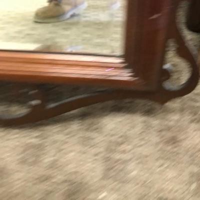 Mirror with decorative top and bottom