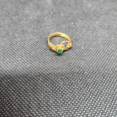 Costume ring with green stone