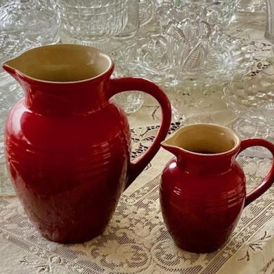Two Le Creuset Red Pitchers