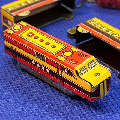 TINY TIN TOY TRAIN CARS x 4