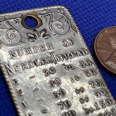MID 1800â€™S NEEDLES, THREAD METAL STAMP CHART