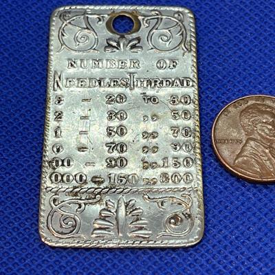 MID 1800â€™S NEEDLES, THREAD METAL STAMP CHART