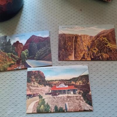 NEW COLORADO COFFEE MUGS, COLORADO POSTCARDS AND PENNIES IN A GLASS BOTTLE