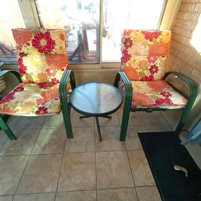 GREEN METAL FRAMED PATIO CHAIRS AND SMALL TABLE