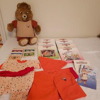 Vintage Teddy Ruxpin with 7 books & tapes, clothes & instructions