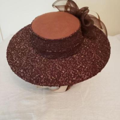 Women's brown felt wide brim hat with brown lace overlay, feathers & a brown net bow