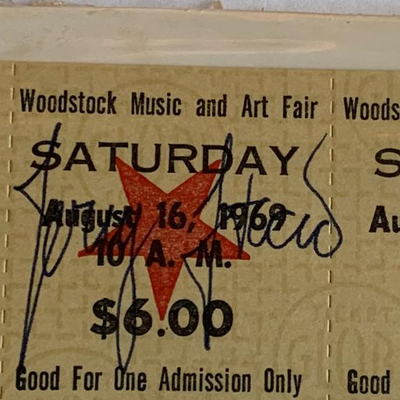 Woodstock ticket with certificate of authenticity & The Story of Woodstock 50 years book