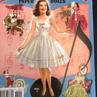 Lot of seven paper doll books