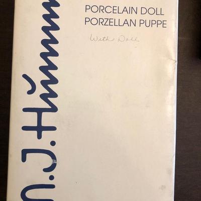 M. J. Hummel doll and Hallmark Peanuts Collection.