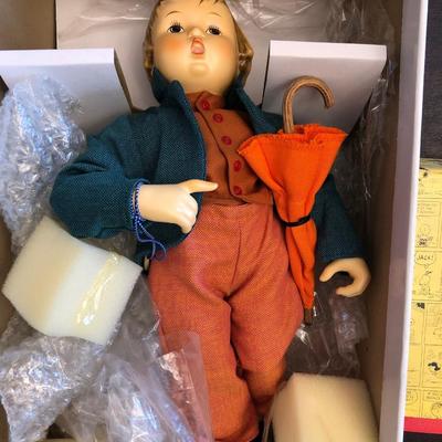 M. J. Hummel doll and Hallmark Peanuts Collection.