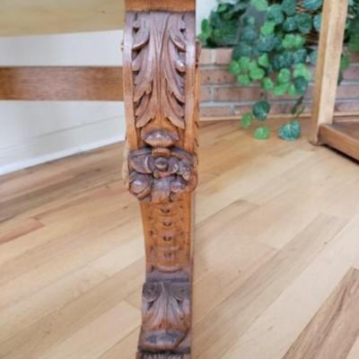 Antique Walnut carved fireside arm chair. Circa 1850.