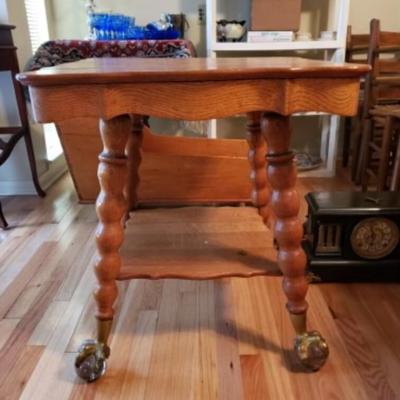 Antique quarter sawnÂ Oak parlor table with large glass ball and claw feet