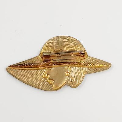 VINTAGE FAUX GOLD TONED WOMAN W/ LARGE HAT PIN