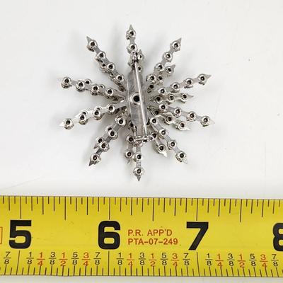 VINTAGE SILVER TONED WHITE STAR BROOCH