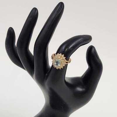 BEAUTIFUL FAUX AQUAMARINE GOLD TONED RING SIZE 6