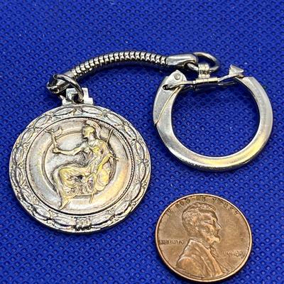 VINTAGE MEDAL SPARTAN SEATED