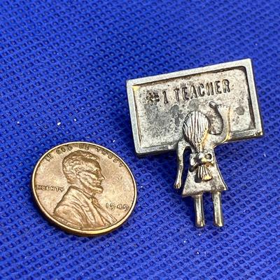 TEACHER PIN STUDENT AT CHALKBOARD