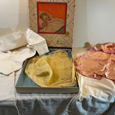 Baby Crib Graphic Box with Hand Crafted Baby Gowns for new baby.