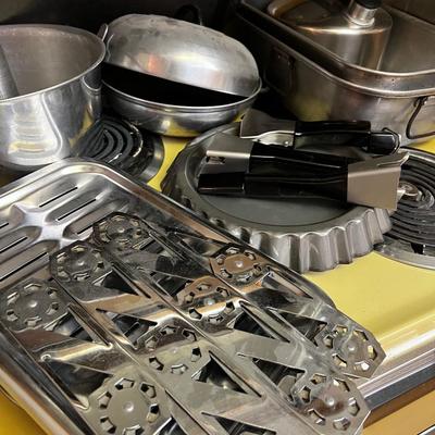 Stovetop Full of Cookware Pots and Pans 