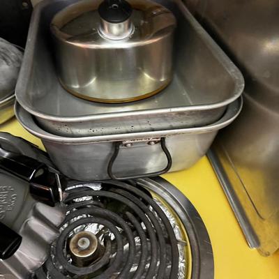 Stovetop Full of Cookware Pots and Pans 