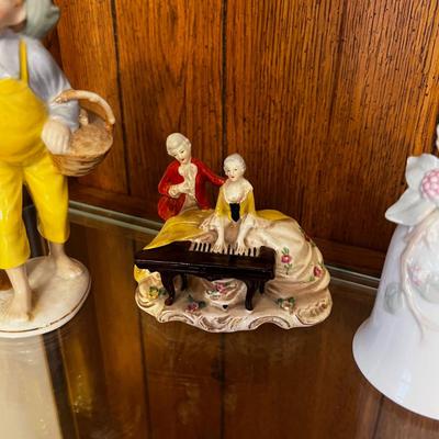 Ceramic Figurines and a bell